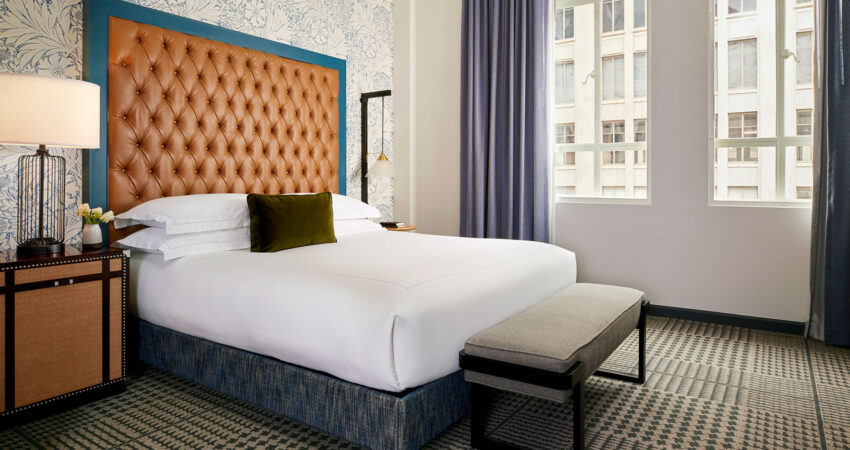 kimpton-denver-colorado-hotel-monaco-guestroom-suite-monte-carlo-sleeping-room-tv-headboard-bed-b34cb2fe